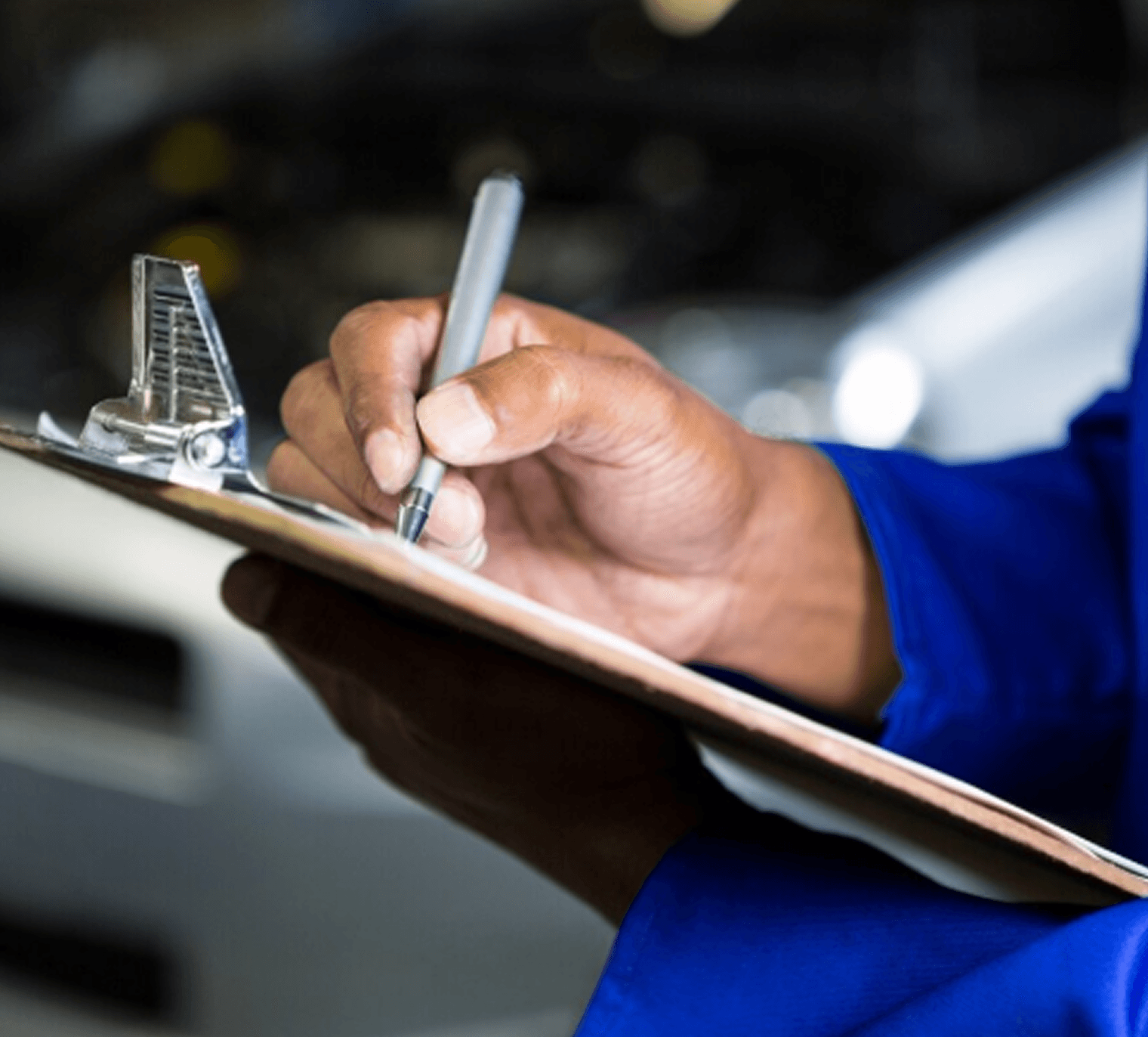 Person holding a phone with a car finance app